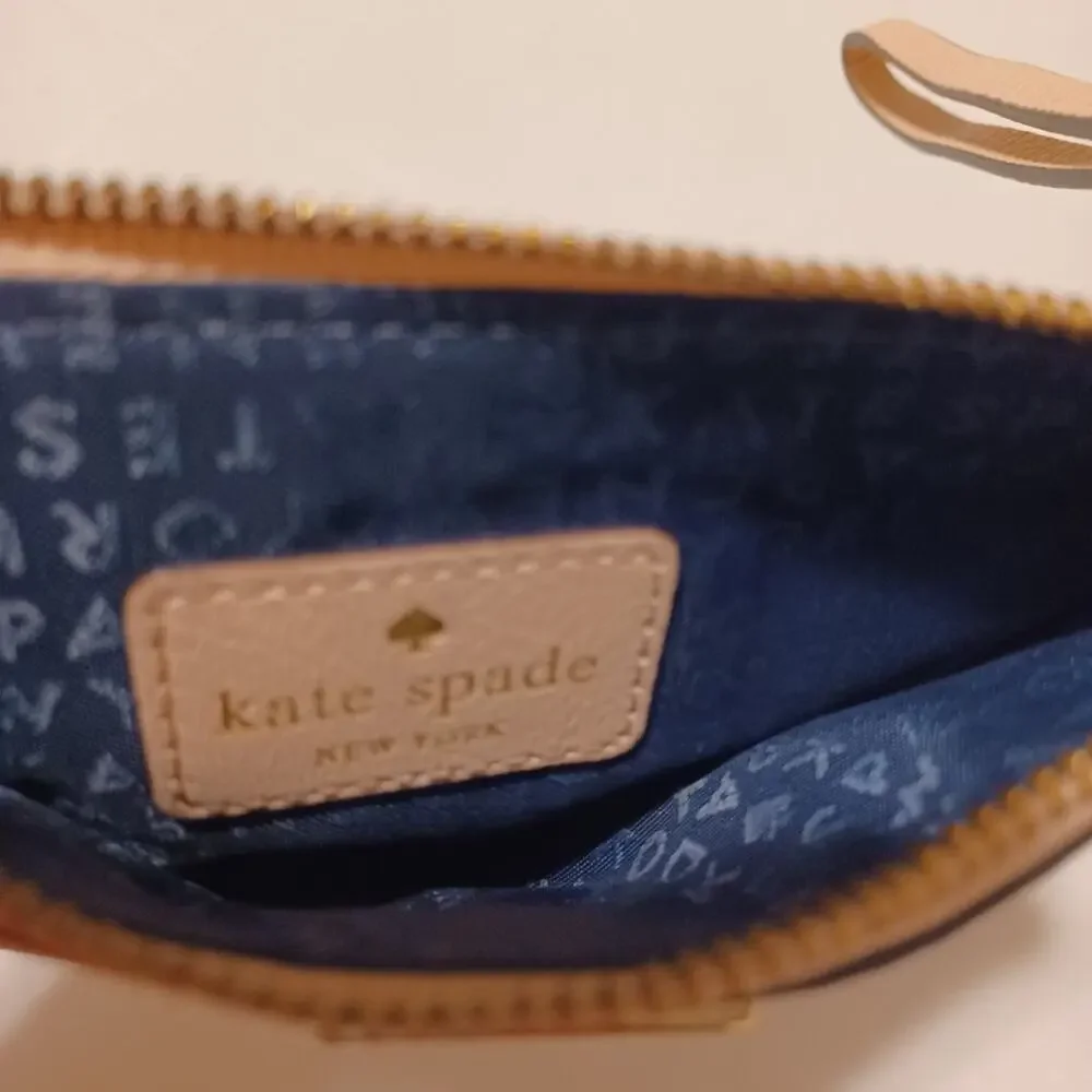 Kate Spade New York Pink Tone Wristlet.